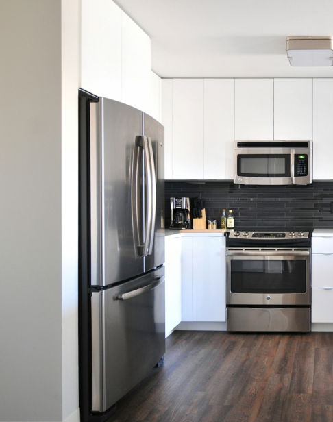 gray steel 3-door refrigerator near modular kitchen